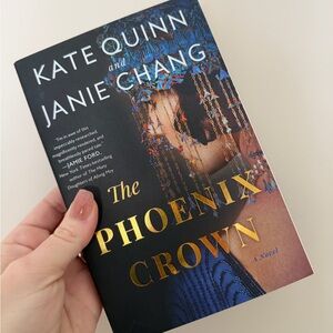 The Phoenix Crown by Kate Quinn & Janie Chang - Black & Gold softcover